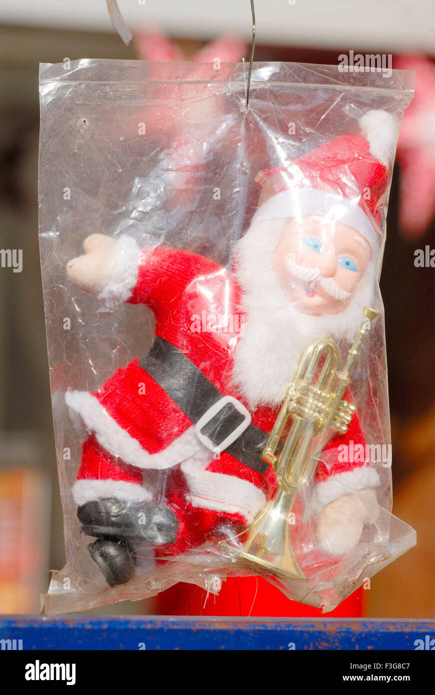 Puff toy ; Santa Claus in traditional dress for celebrating Christmas Festival kept for sell in shop Borivali Mumbai Stock Photo