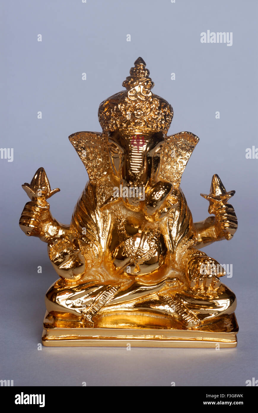 Pure gold plated idol of lord ganesha (elephant headed god) ; Bombay now Mumbai ; Maharashtra ; India Stock Photo