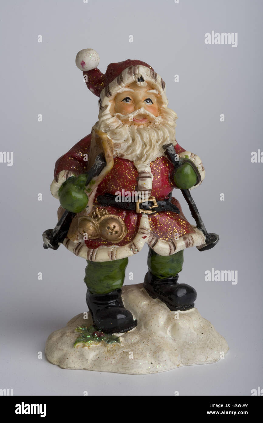 Santa Claus, Father Christmas, Saint Nicholas, Saint Nick, Kris Kringle, Santa, toy, doll, replica, white background Stock Photo