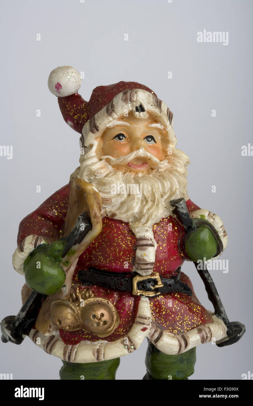 Santa Claus, Father Christmas, Saint Nicholas, Saint Nick, Kris Kringle, Santa, toy, doll, replica, white background Stock Photo