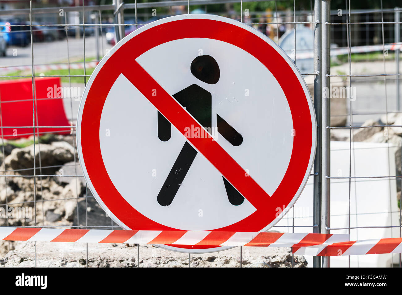 Entry prohibited road sign hanging on construction area border Stock