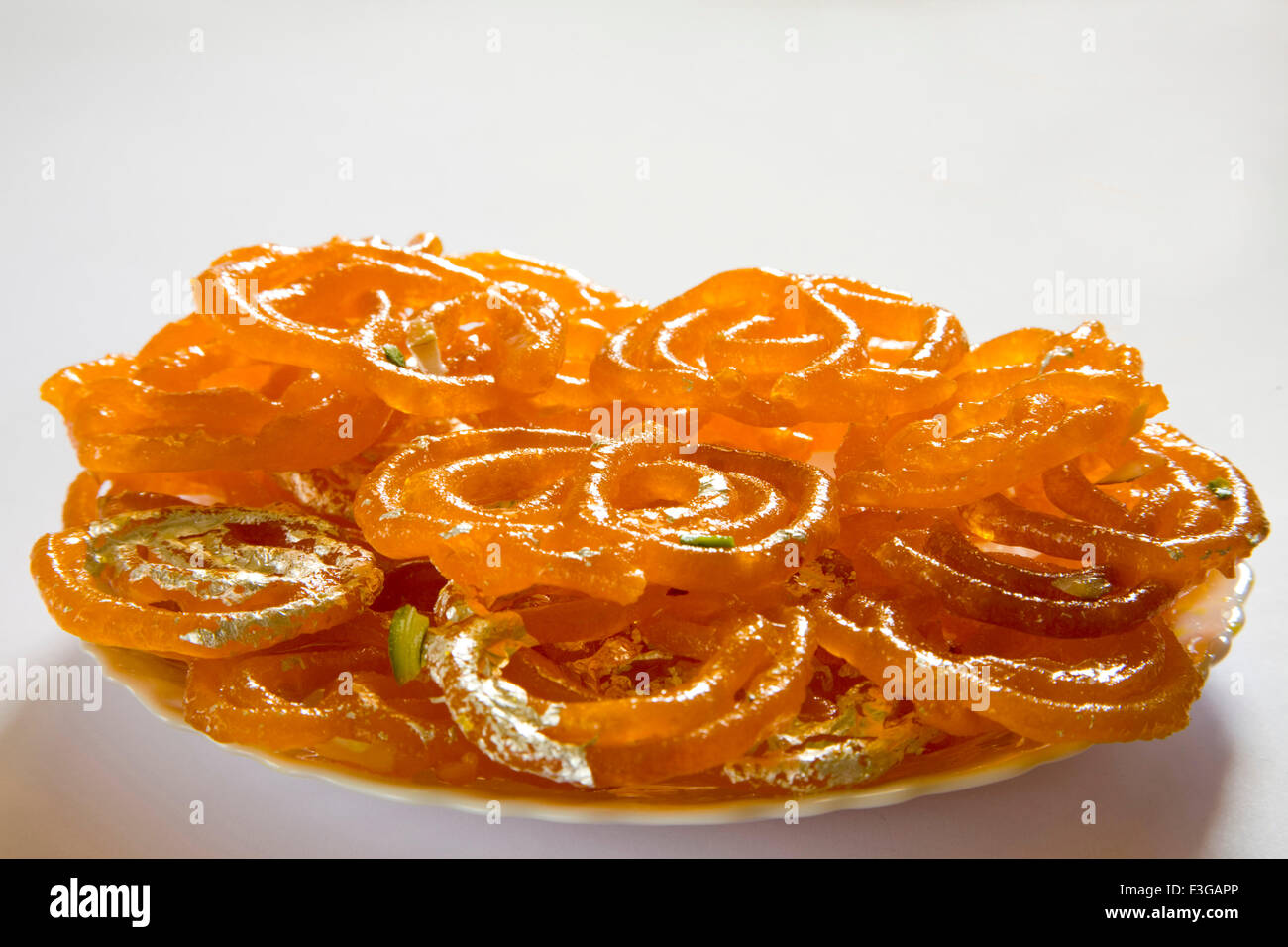 Indian sweet food Bonbon Confectionery Jalebee served in plate Stock Photo