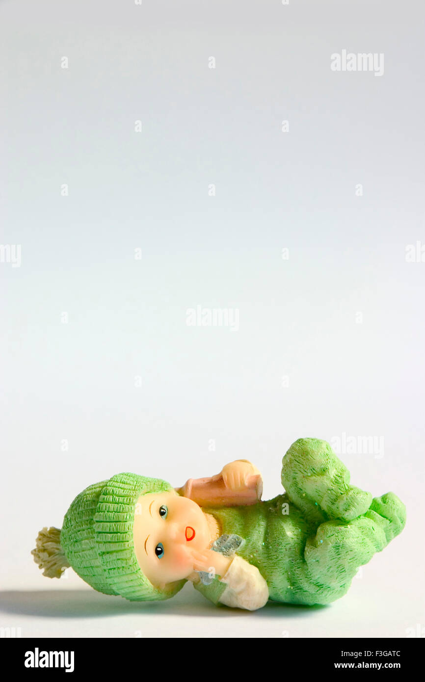 Concept ; showpiece ceramic baby toy male on white background Stock Photo