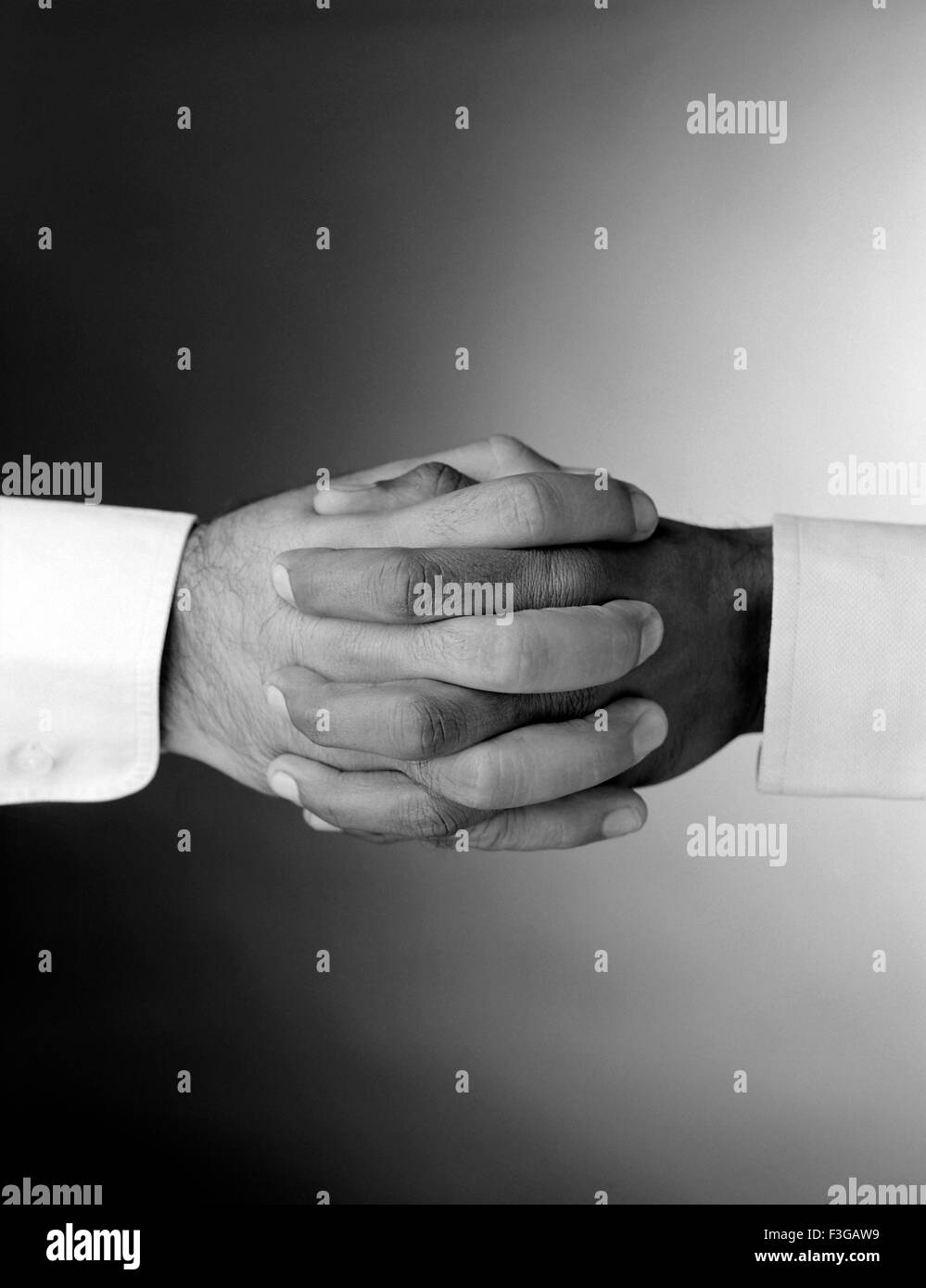 Hands clasped Stock Photo