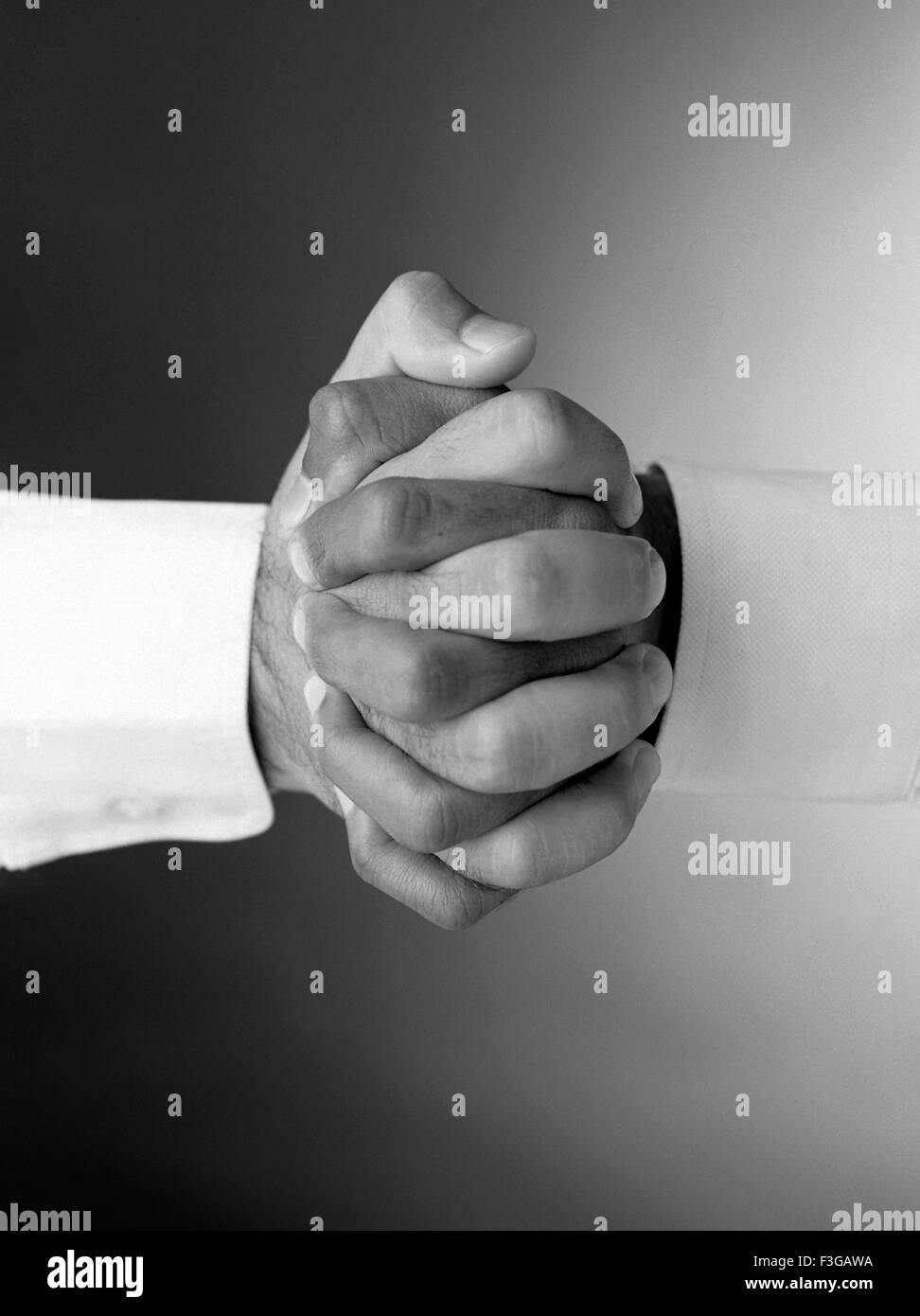 Hands clasped Stock Photo
