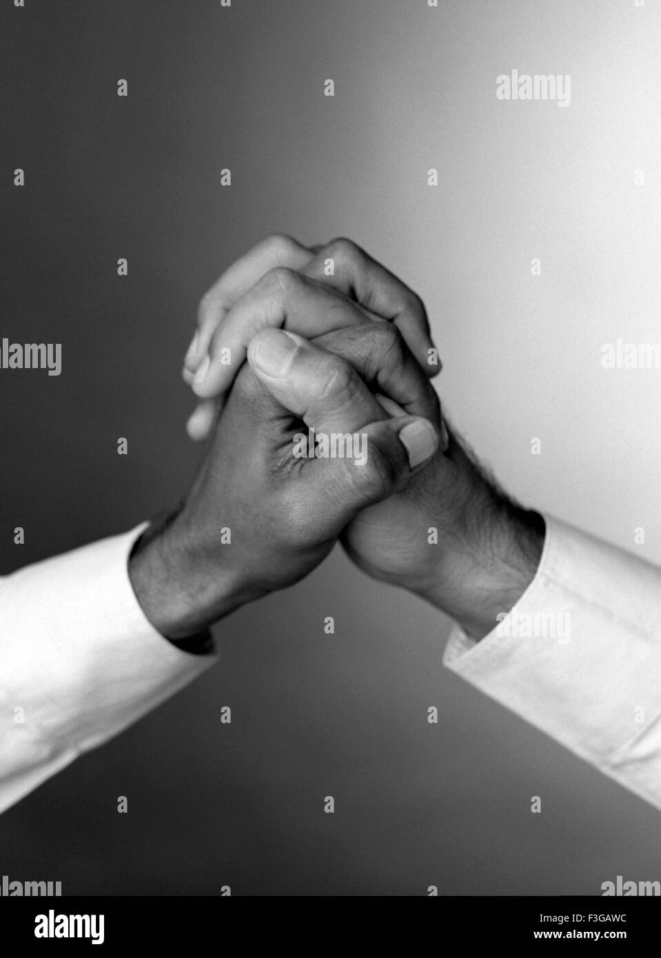 Hands clasped, Hand clasping Stock Photo