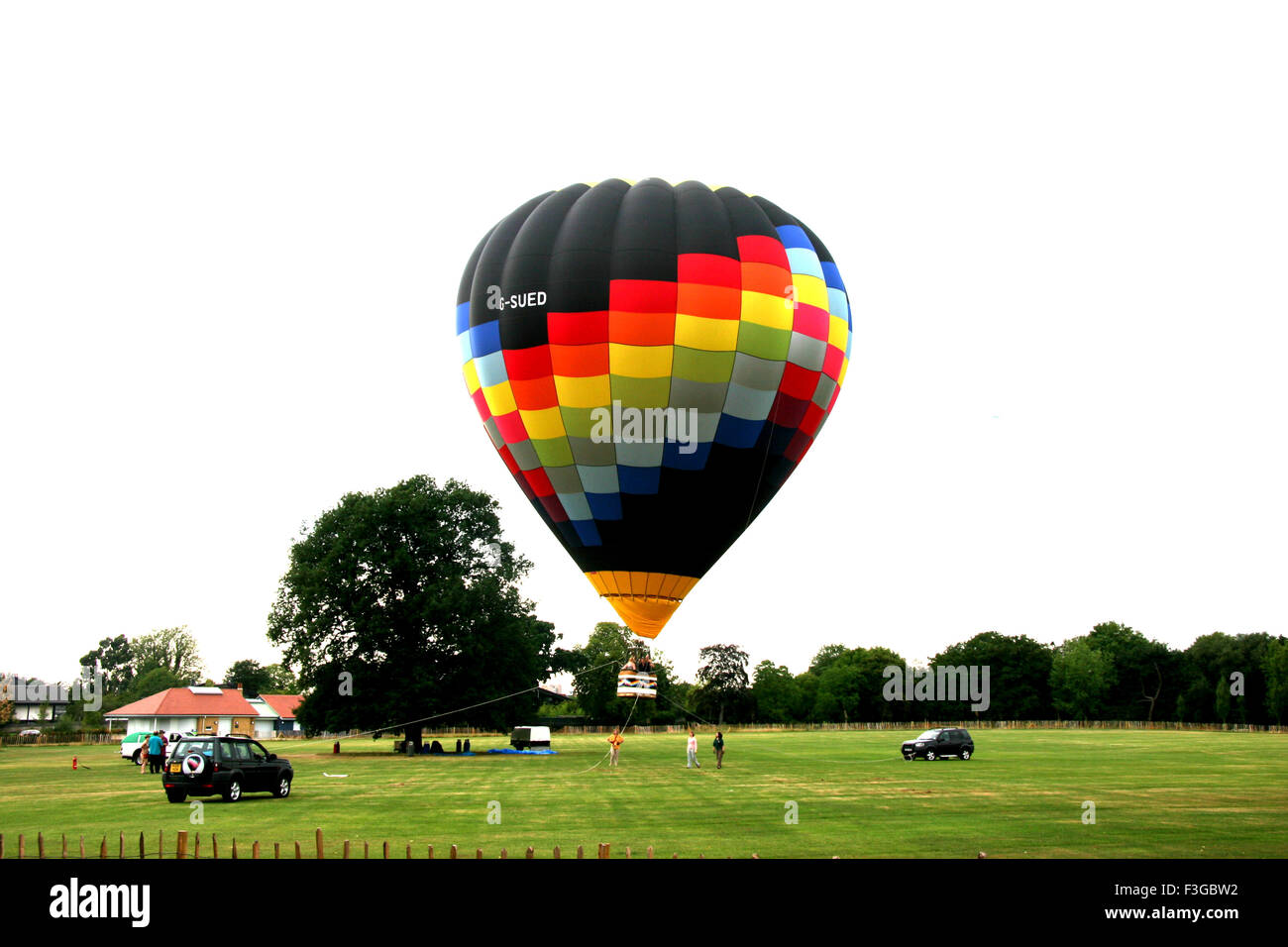 Colorful Hot Air Balloon About To Take Off and Floating in Air ; Ludwich ; London ; U.K. United Kingdom England Stock Photo