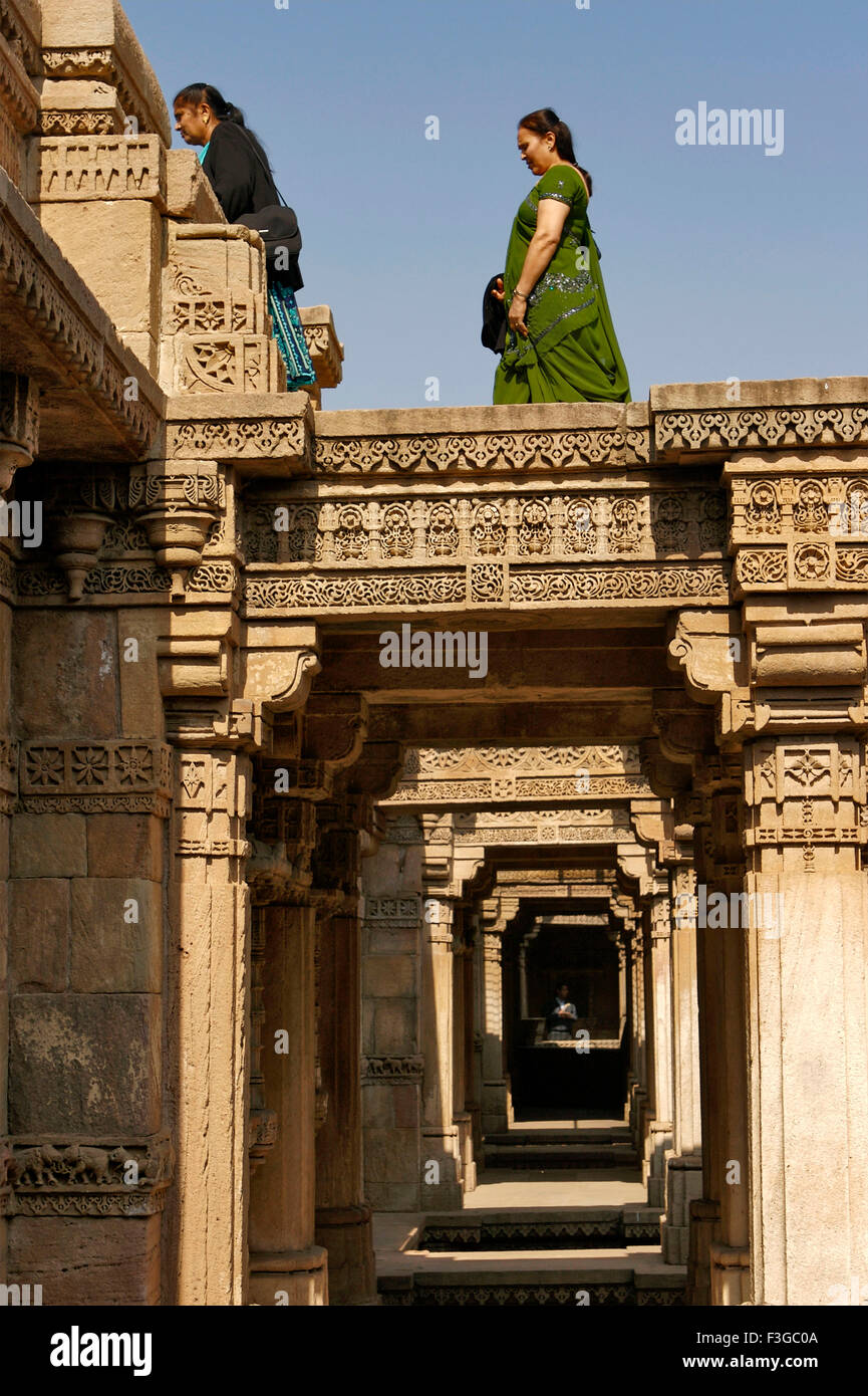 Women at Adalaj Vava step well built by Queen Rudabai Heritage site maintained by Archaeological Department ; Ahmedabad Stock Photo