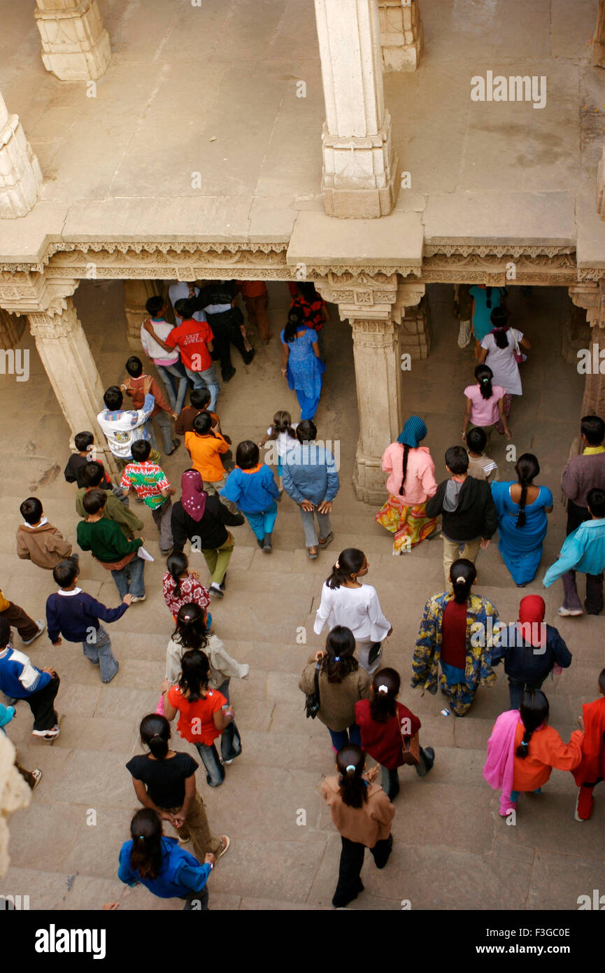 Visitors at Adalaj Vava step well built by Queen Rudabai Heritage site ; Ahmedabad ; Gujarat ; India Stock Photo