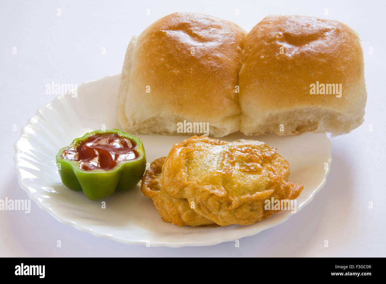 Indian fast food fried batata or potatoes vada with bun pav served with