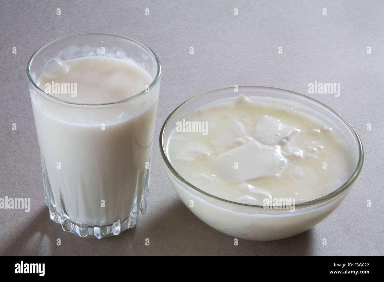 Full glass of milk and curd yogurt dahi made from milk home or dairy