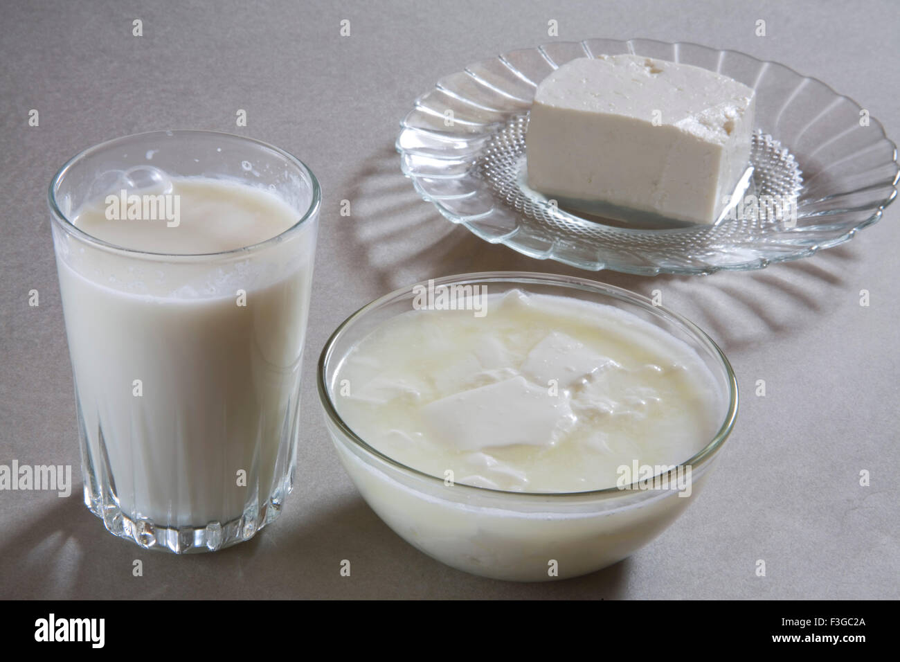 Full glass of milk curd yogurt dahi and cottage cheese