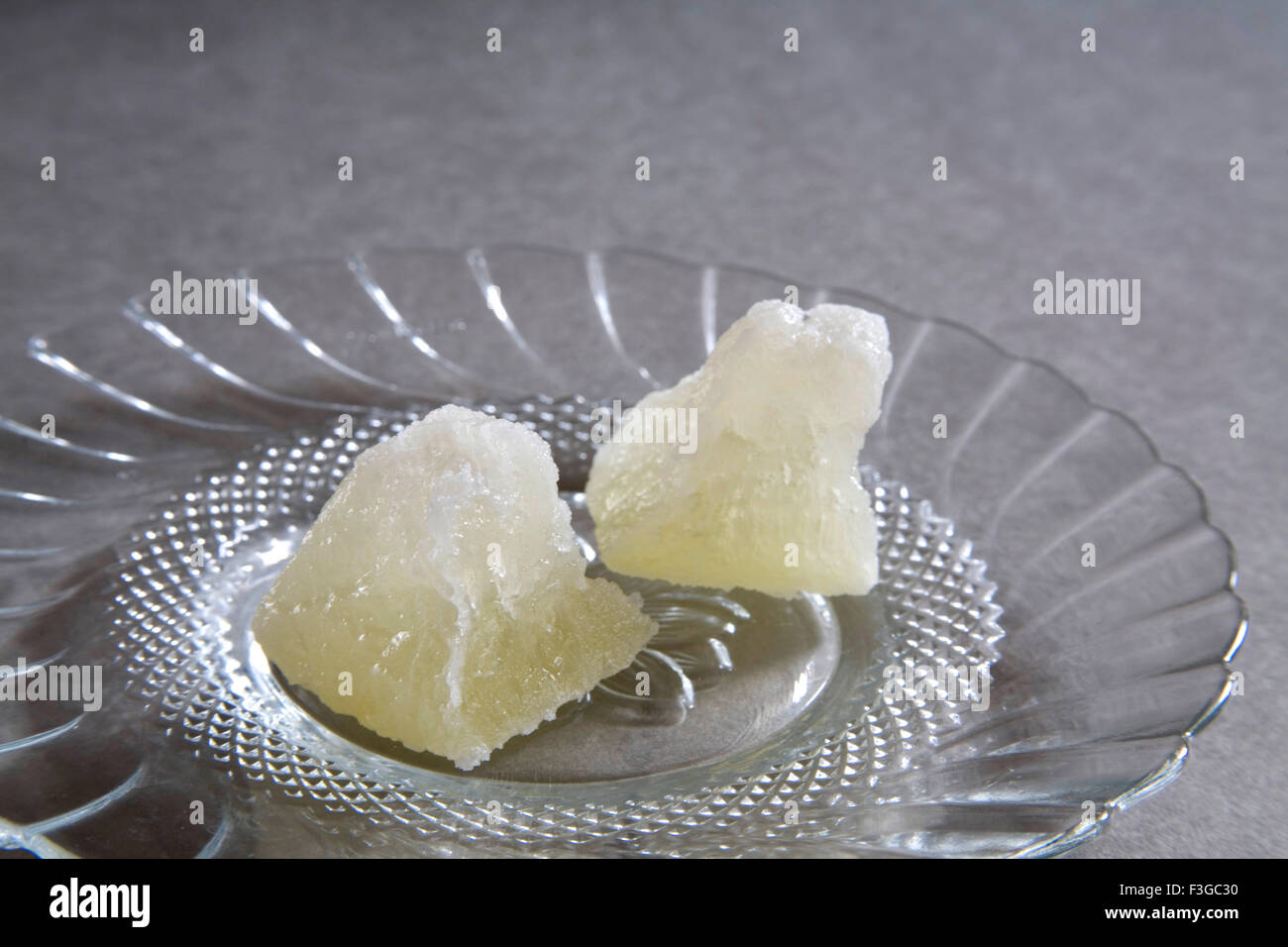 Indian sweet petha bon bon confectionery mithai made from white pumpkin peeled and cubed deep fry sugar syrup served plate Stock Photo