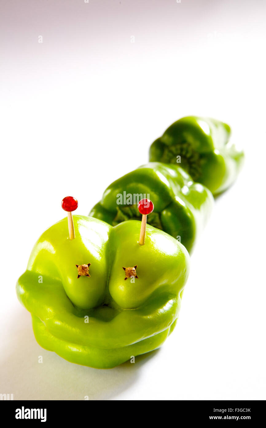 Alien capsicum concept creative modern toy on white background ; India Stock Photo