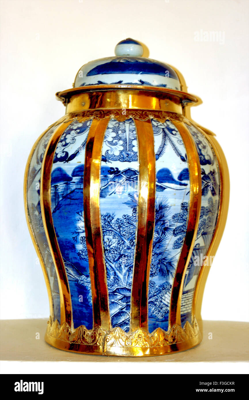 Blue jar enclosed in brass fittings at sharad baug ; kutch ; Gujarat ; India Stock Photo
