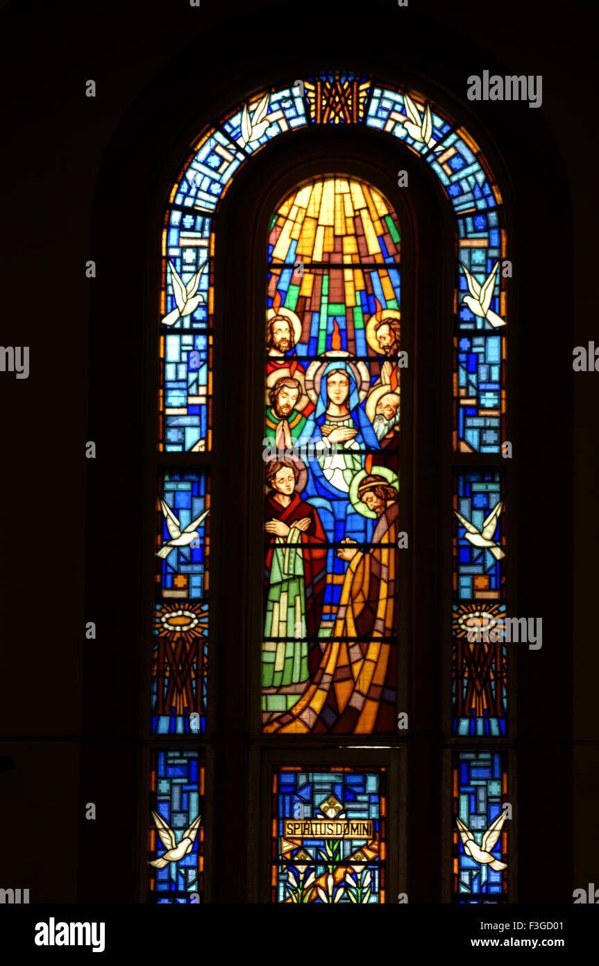 Spiritual dominic holy sprit descending on apostles on stained glass in basilica of St. Benedicta of cross Stock Photo