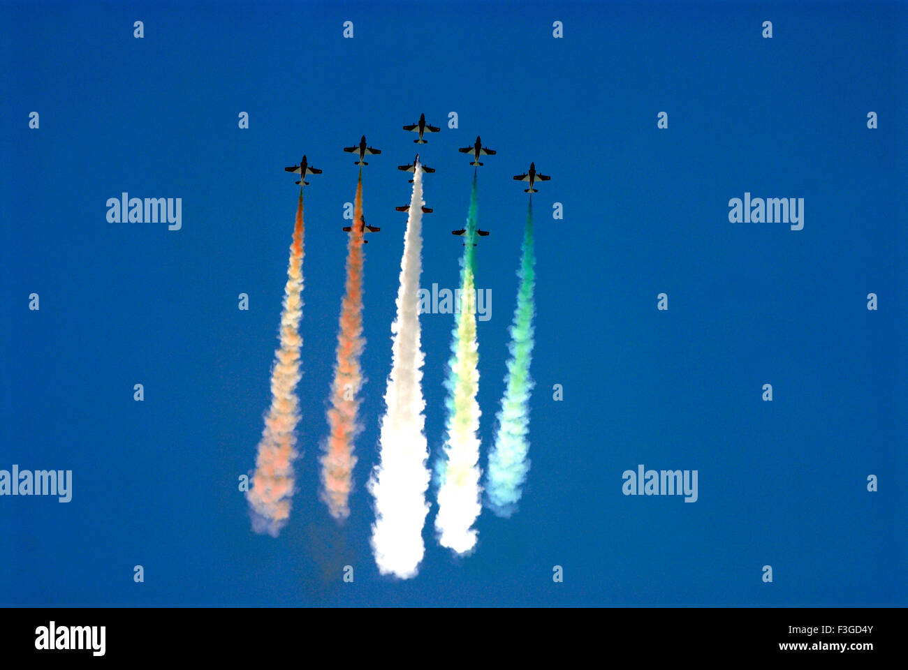 Air show acrobatic of Suryakiran team of IAF at Shanghumugom beach ; Trivandrum ; Kerala ; India Stock Photo