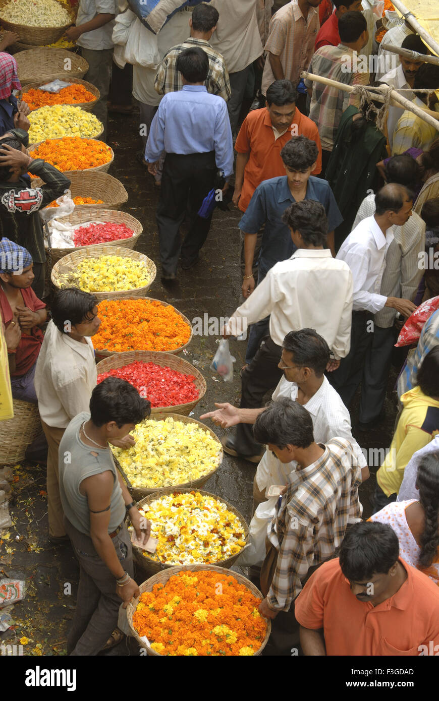 Row of flower seller at Dadar Phul market ; Dadar ; Mumbai Bombay ; Maharashtra ; India Stock Photo