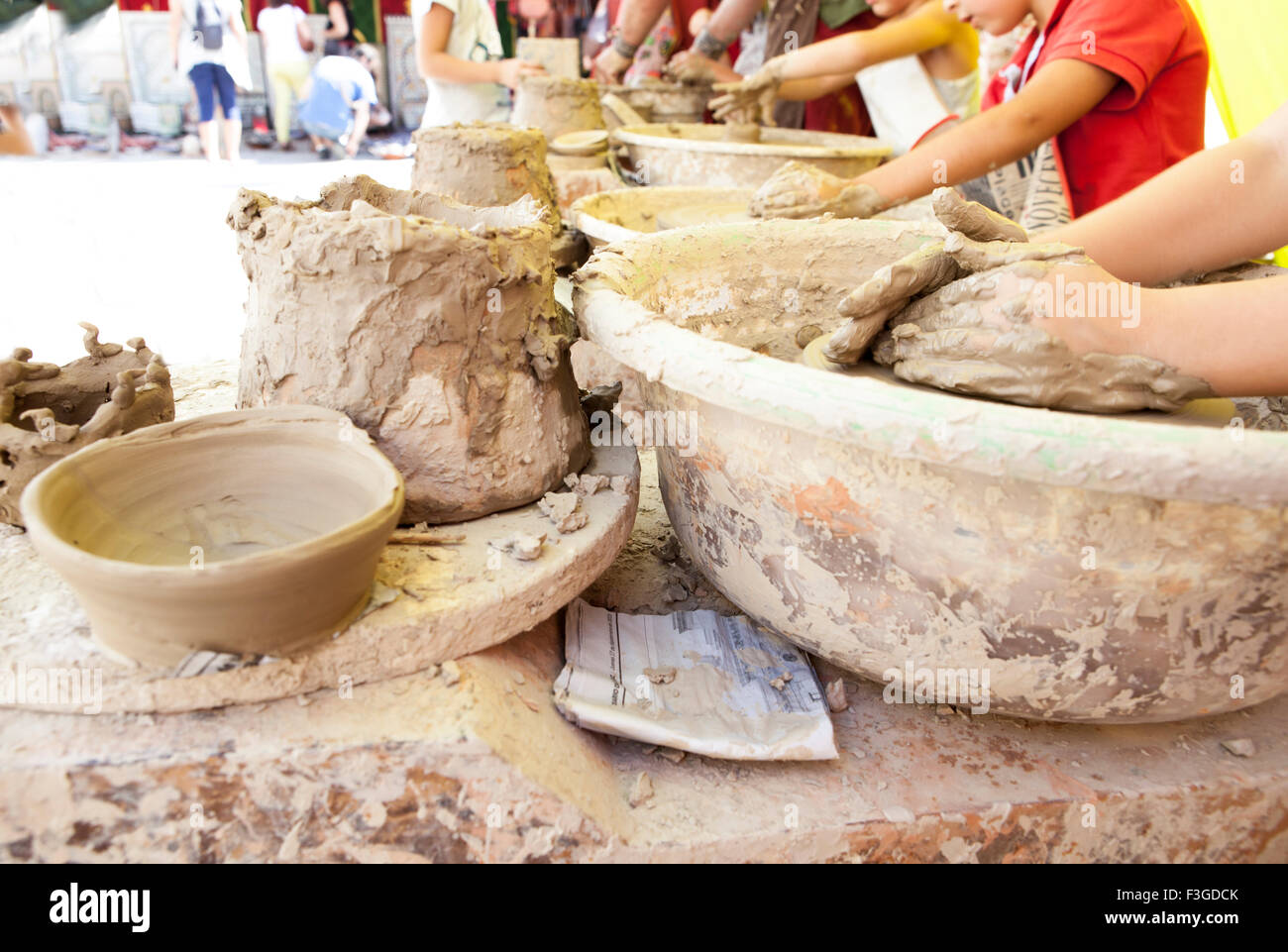 Children learning to work with potter's wheel Stock Photo Alamy