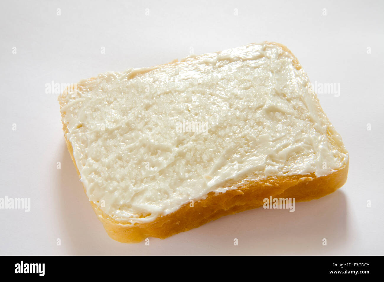 Breakfast food ; butter applied on single slice of bread Stock Photo