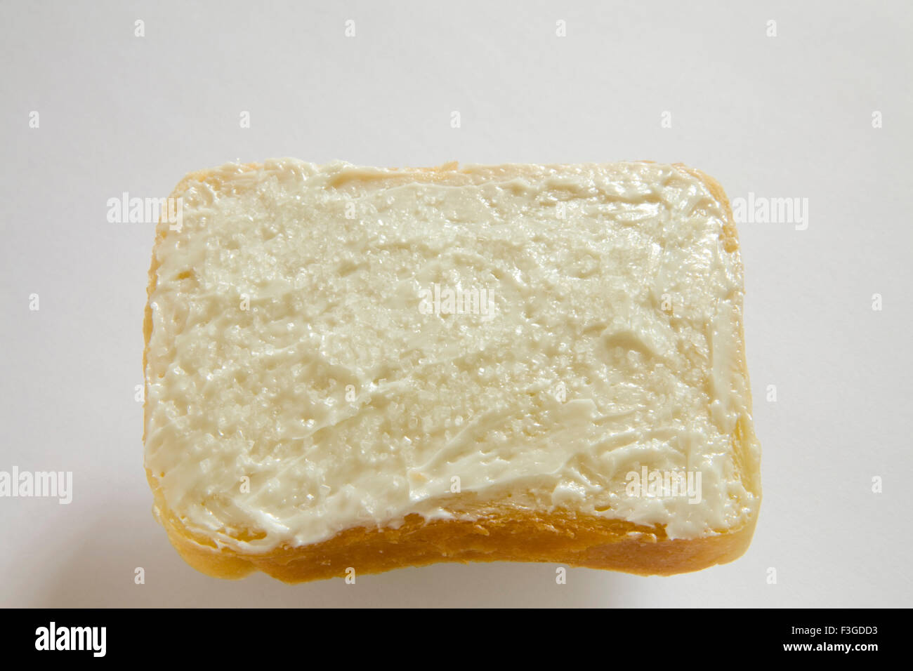 Breakfast food ; butter applied on single slice of bread Stock Photo