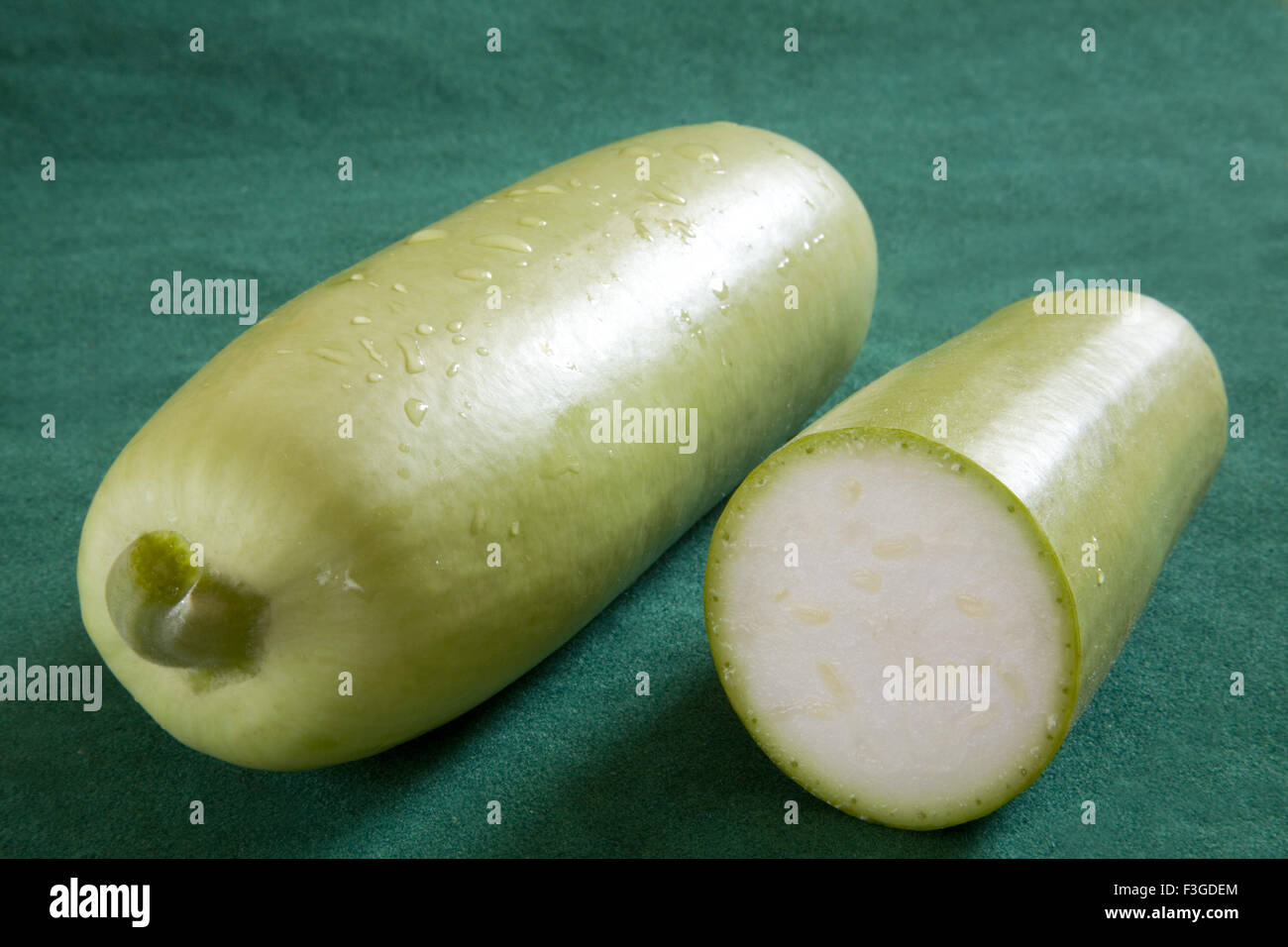 One full and half cut green vegetable Bottle Gourd doodhi lauki on