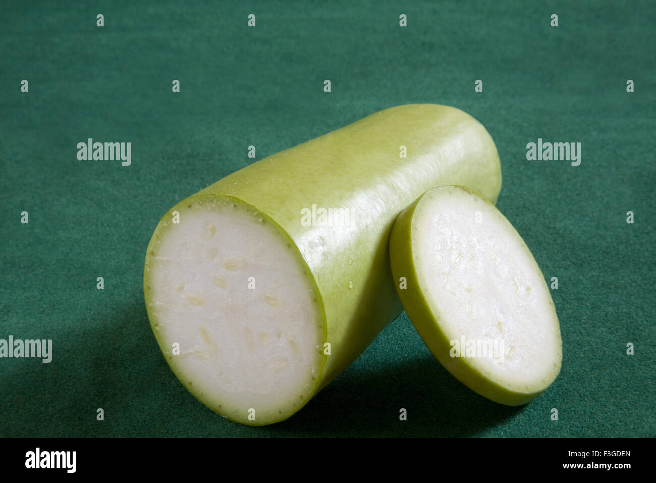 Half cut with one slice of green vegetable Bottle Gourd doodhi lauki on