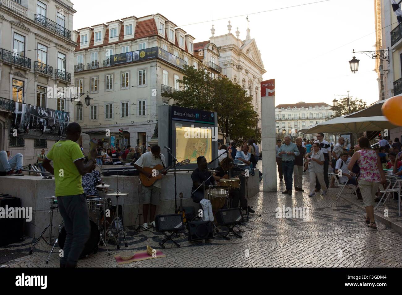 LISBON, PORTUGAL - OCTOBER 23 2014: Baixa Chiado metro station in Lisbon, with street  performers singing at sunset time with No Stock Photo