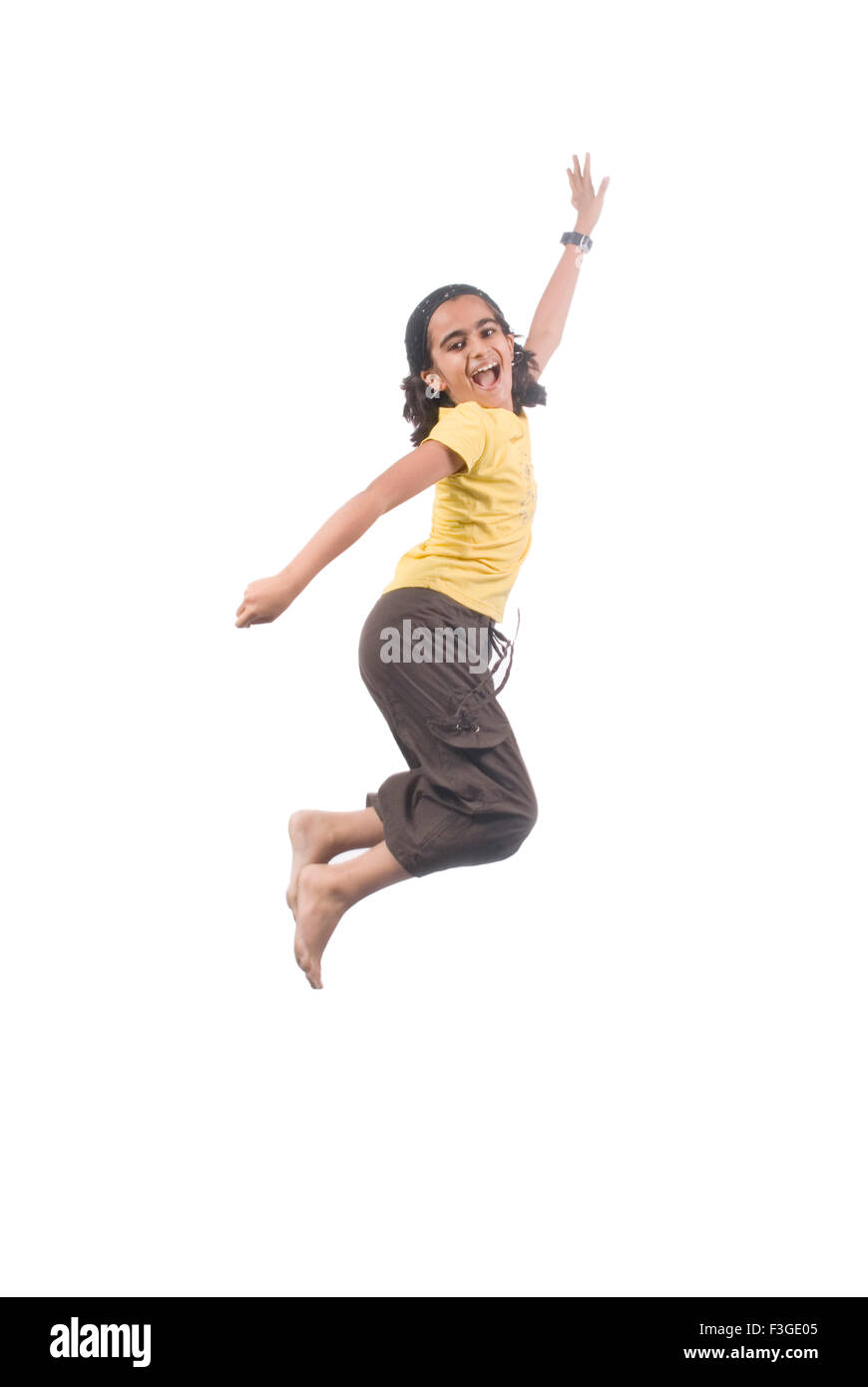 Teenager girl jumping in mid air with joy MR#733 Stock Photo