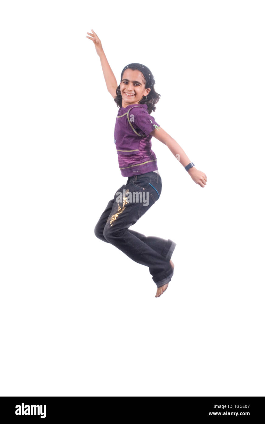 Teenager girl jumping in mid air with joy MR#733 Stock Photo