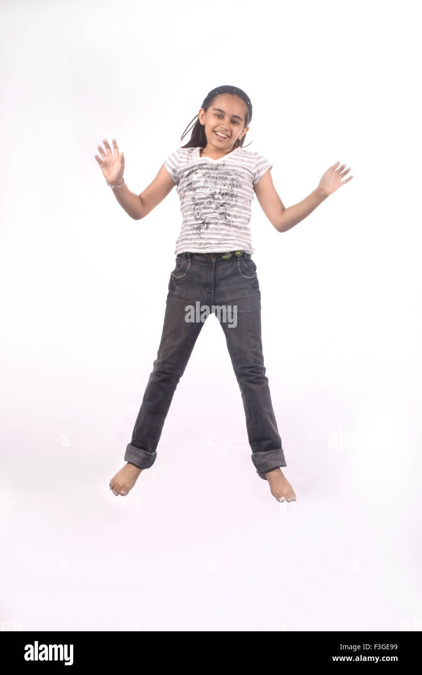 Young girl jumping in mid air MR#733 Stock Photo