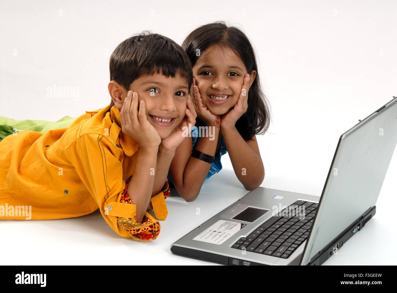South Asian Indian brother and sister with laptop ; Bombay Mumbai ; Maharashtra ; India MR#364 Stock Photo
