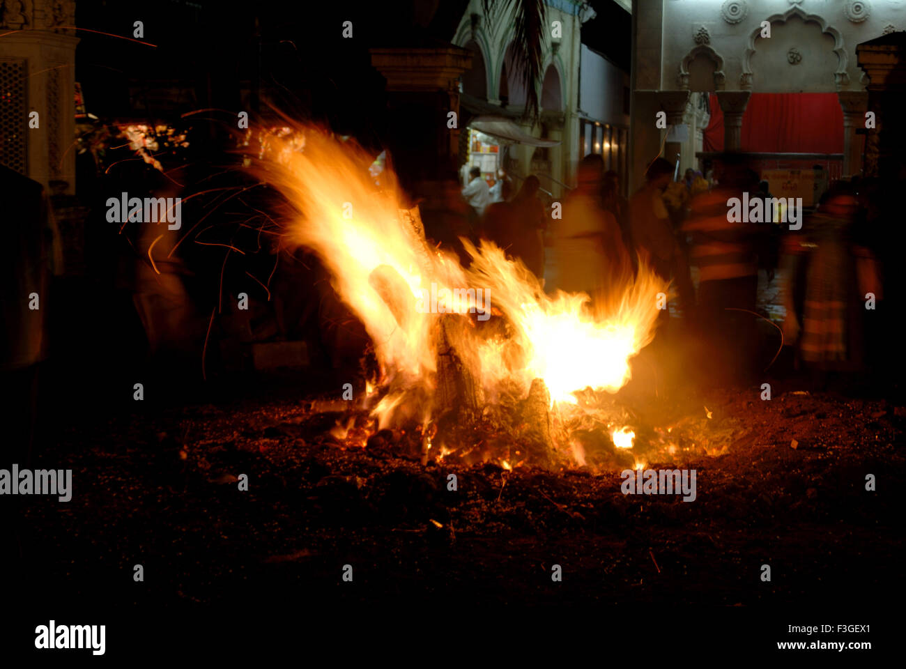 Holi festival ; bon fire with wood stick and dry grass ; Mumbai Bombay ; Maharashtra ; India Stock Photo