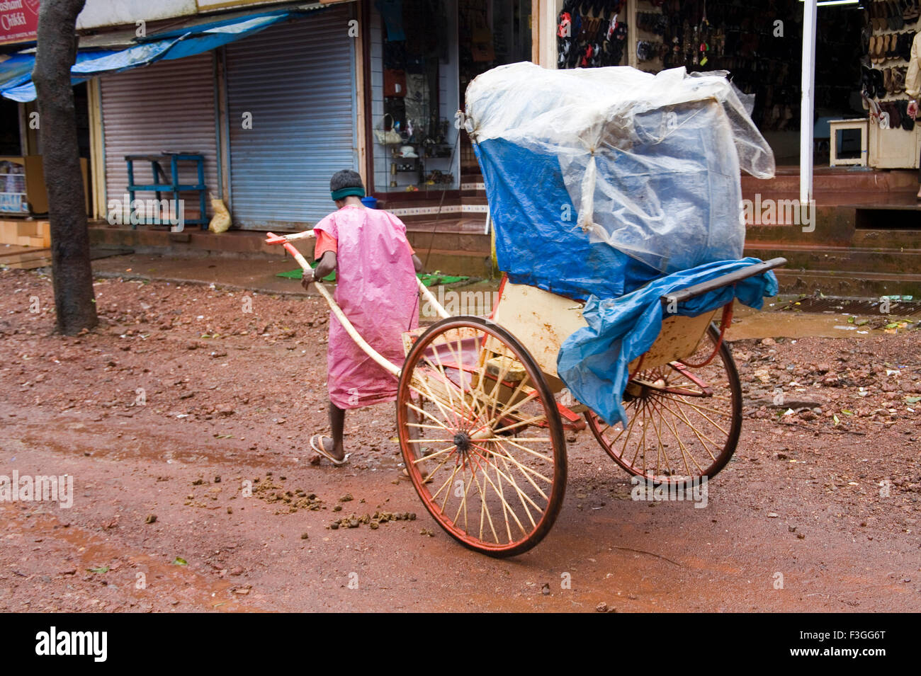 Man driven pulled rickshaw ; Matheran ; Maharashtra ; India Stock Photo