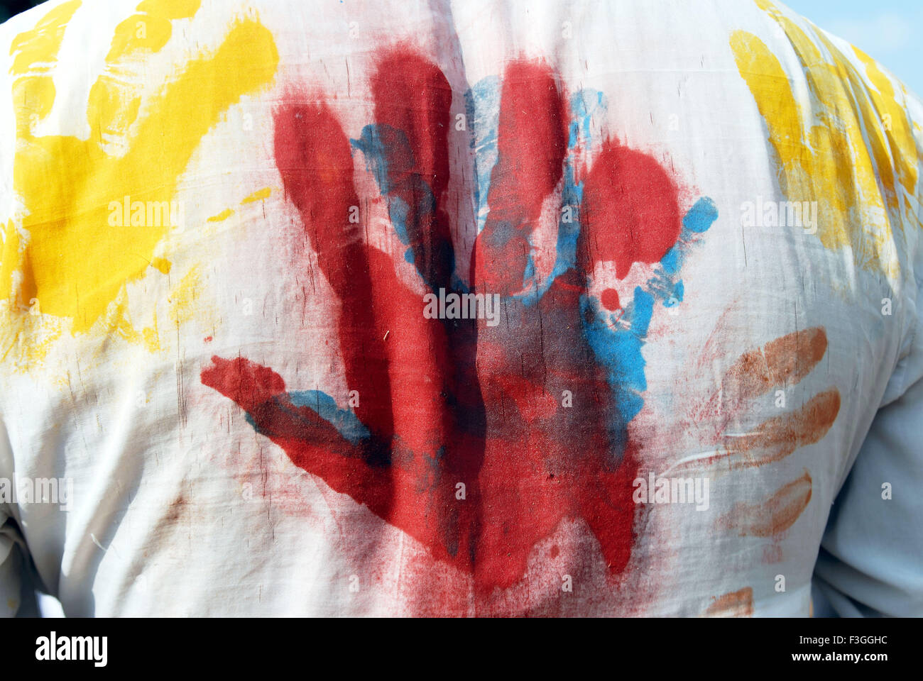 holi featival, red palm hand print on white shirt, india, asia Stock Photo