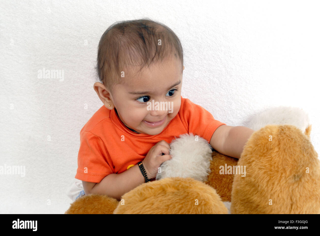 Baby boy playing with soft toys MR#152 Stock Photo - Alamy