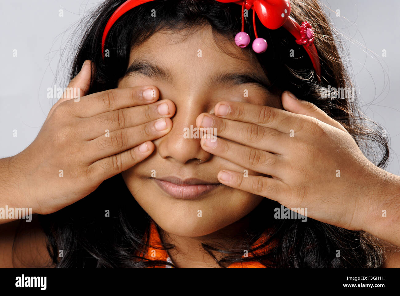 baby girl child with hands covering eyes playing hide and seek MR152