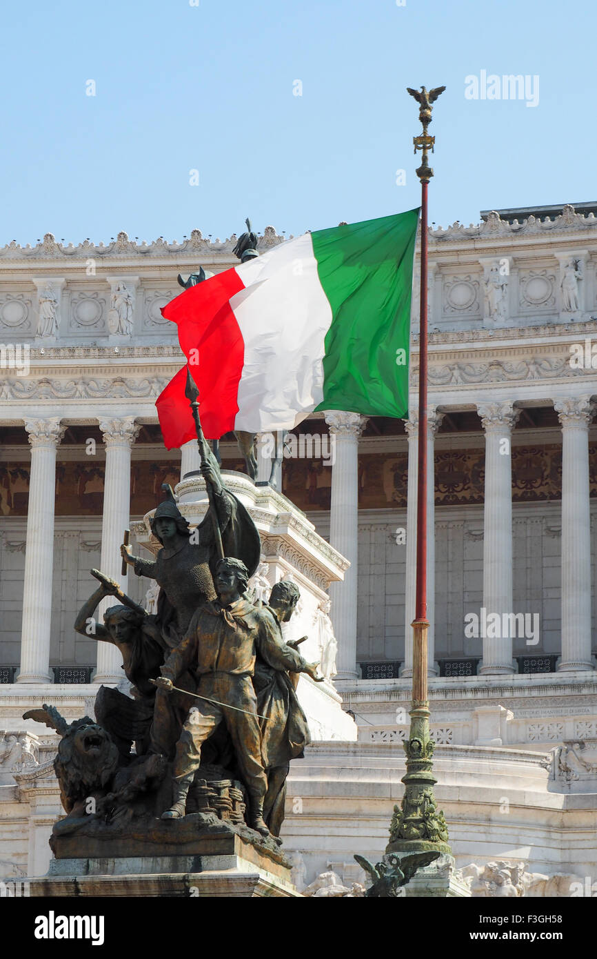 The Italian flag, Tricolore, flying in front of the National Monument to Victor Emmanuel II,Rome. Stock Photo