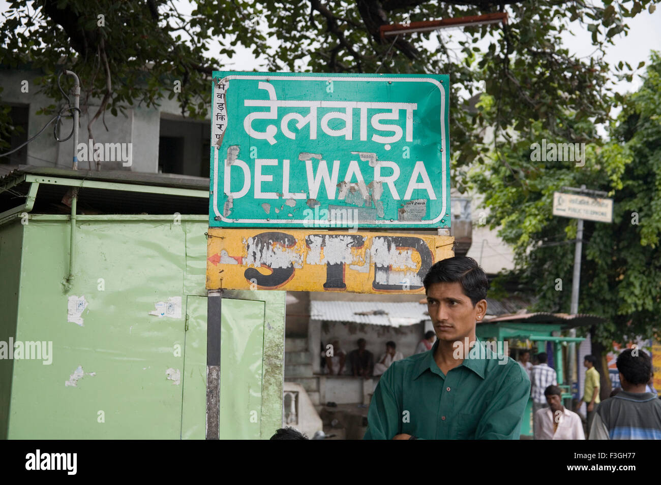 Man standing near the sign board ; Village Delwara ; Udaipur