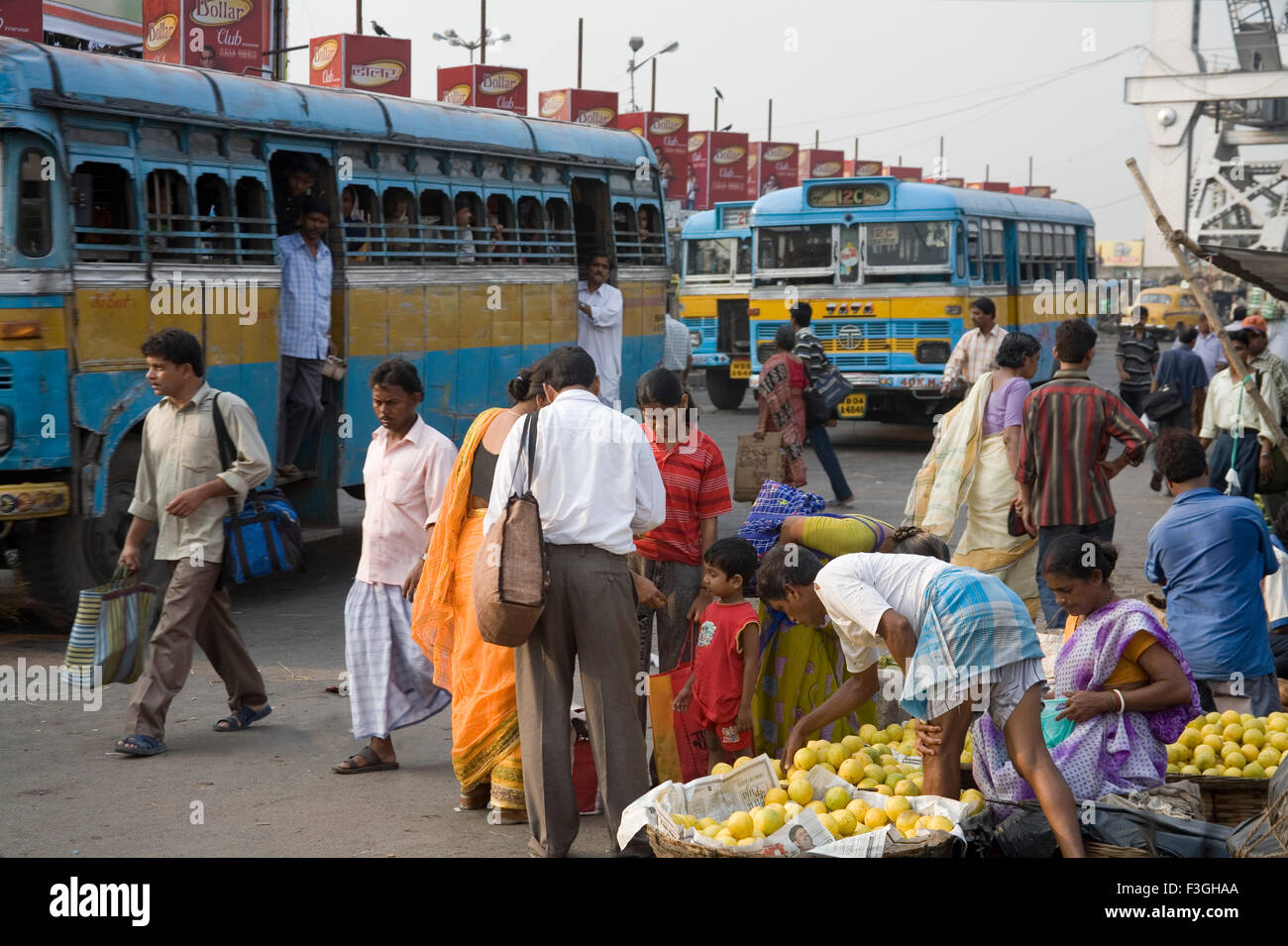Street scene ; local transportation buses and people in market