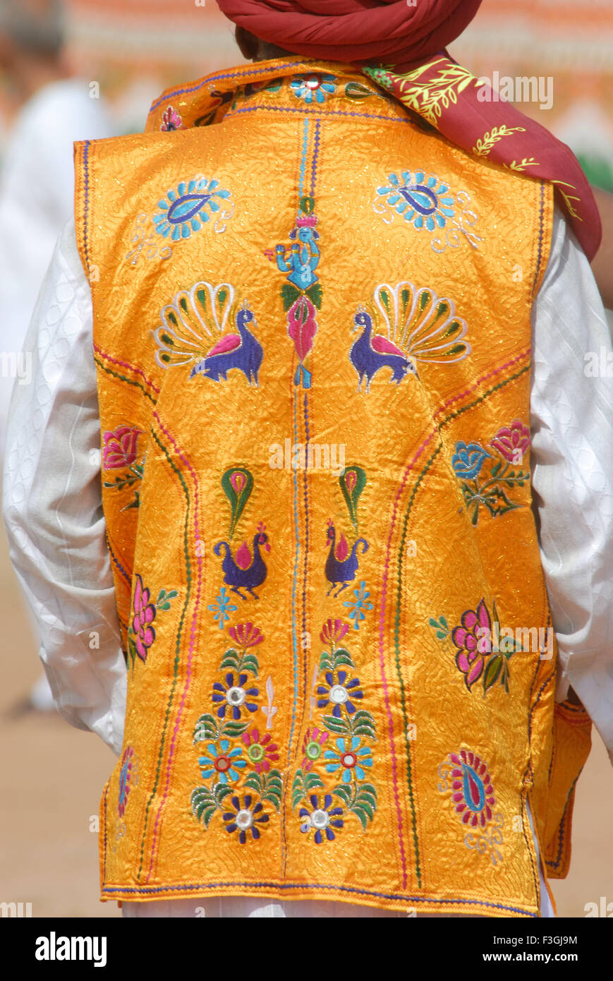 Man wearing embroidered jacket Stock Photo
