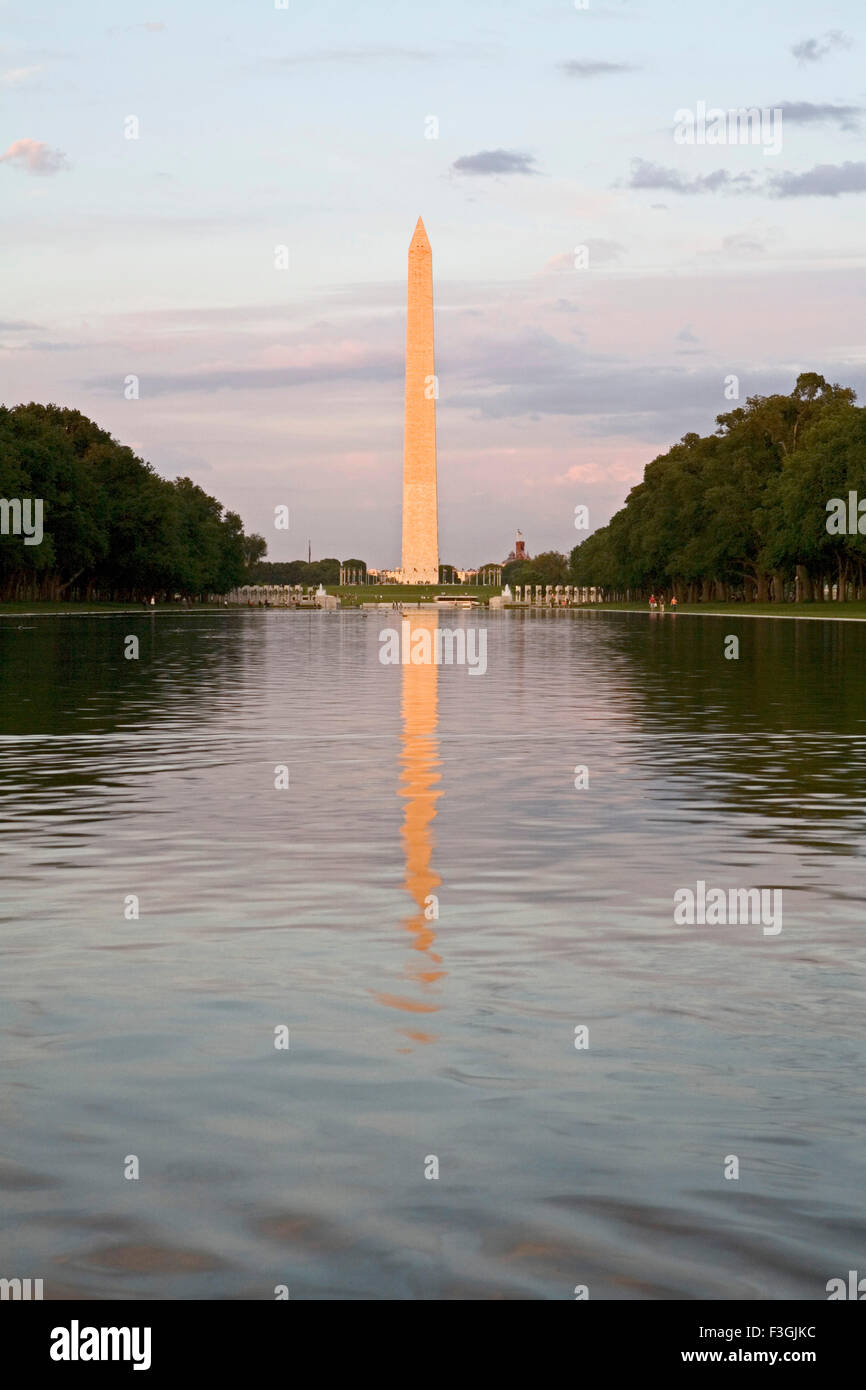 A 555 ft tall Washington monument rises above the mall in Washington dc ; U.S.A. United States of America Stock Photo