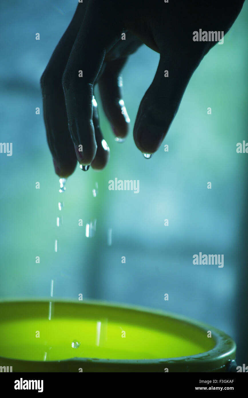Water dripping from wet fingers Stock Photo Alamy