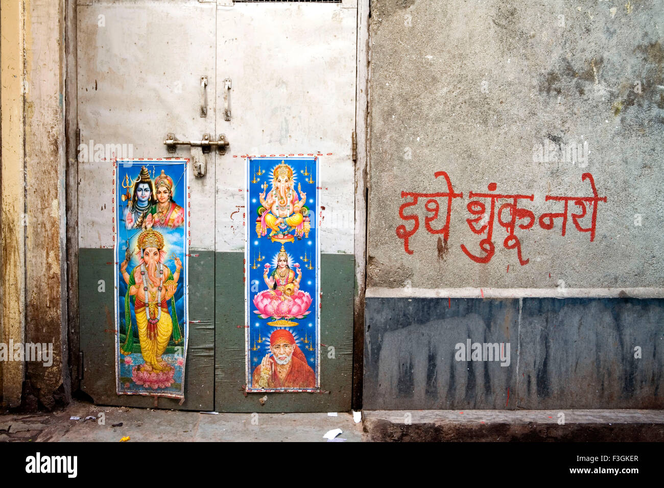 Images of Indian Gods and Goddesses pasted on wall at a public space which  is prone for spitting and urinating Mumbai Stock Photo - Alamy