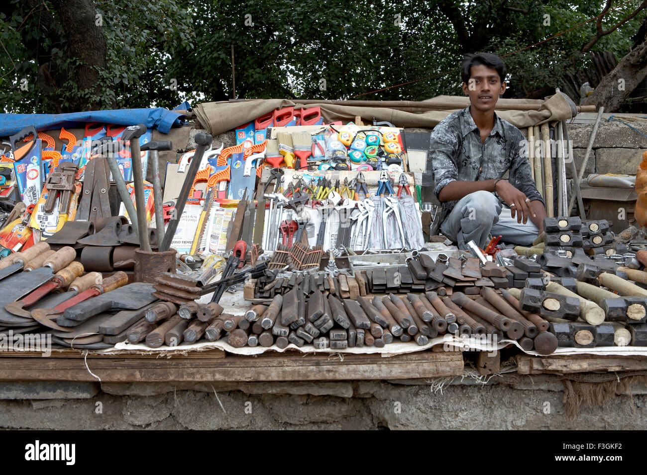 Display of all kinds of hardware tools on the roadside by a hawker