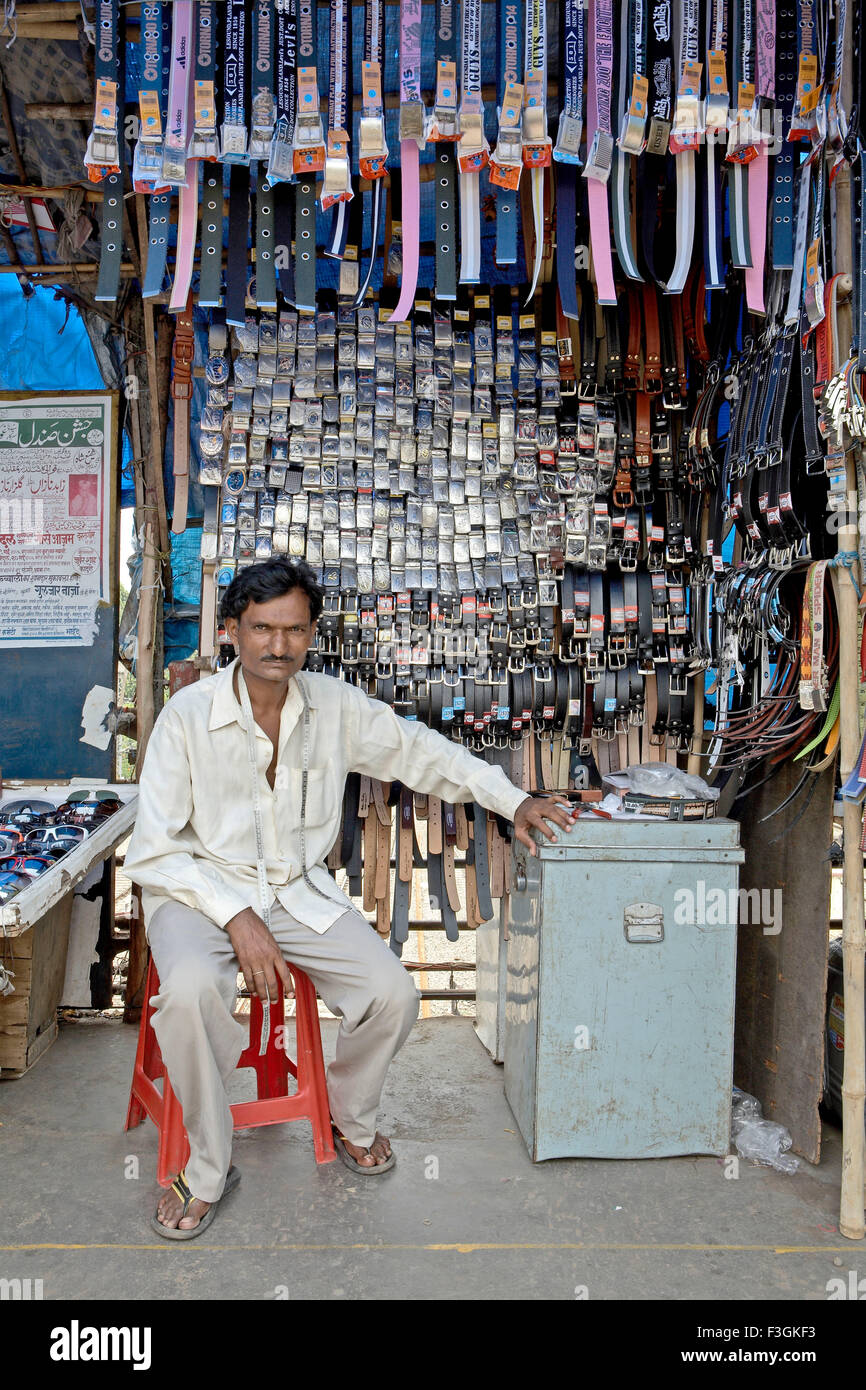 Belts of all shapes and sizes displayed on a roadside by a hawker Mumbai Stock Photo