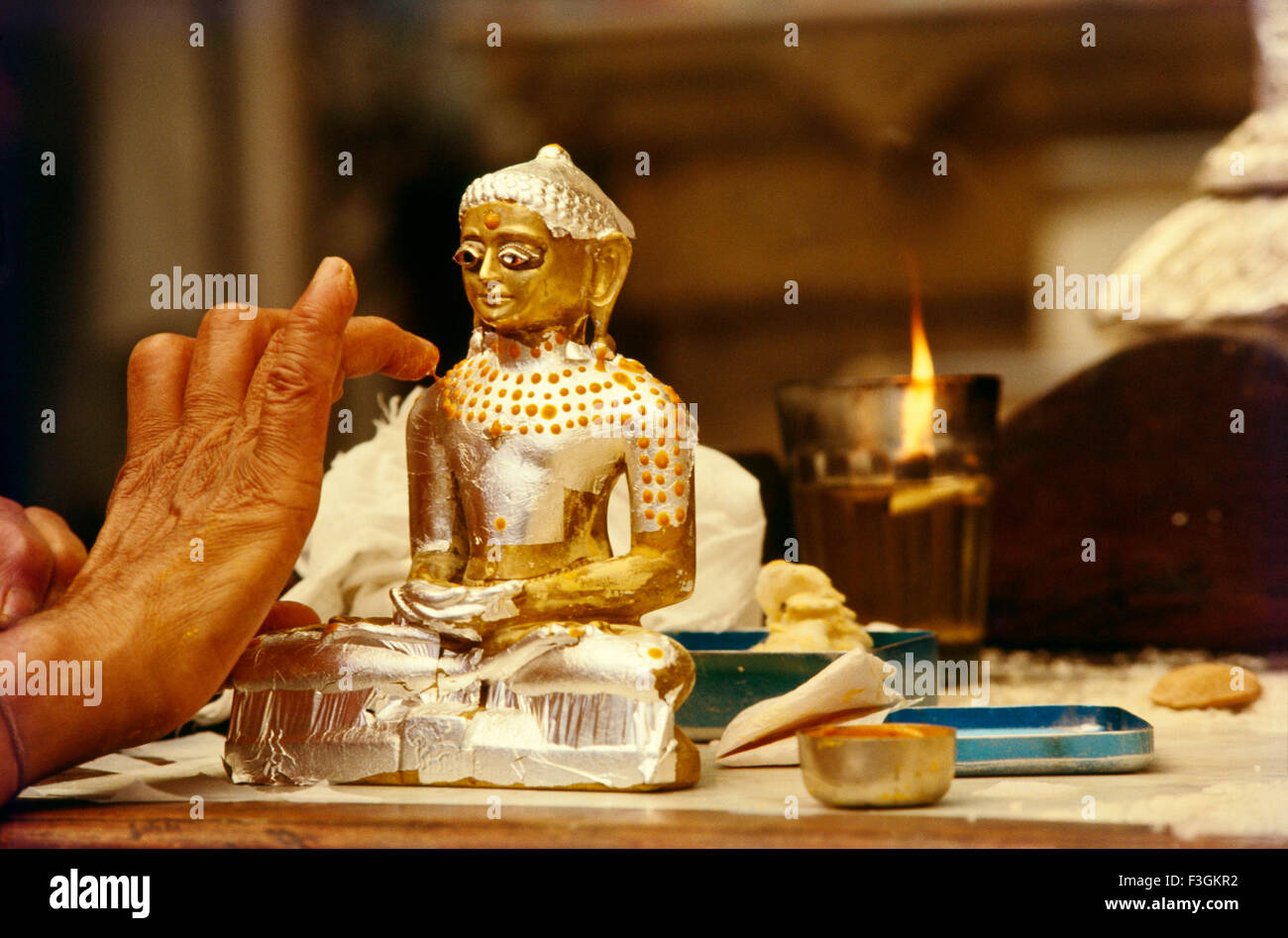 Statue of Lord Mahavir in Jain temple, Mahavira, Vardhamana, Mahaveer, silver statue, gold statue, Bombay, Mumbai, Maharashtra, India Stock Photo