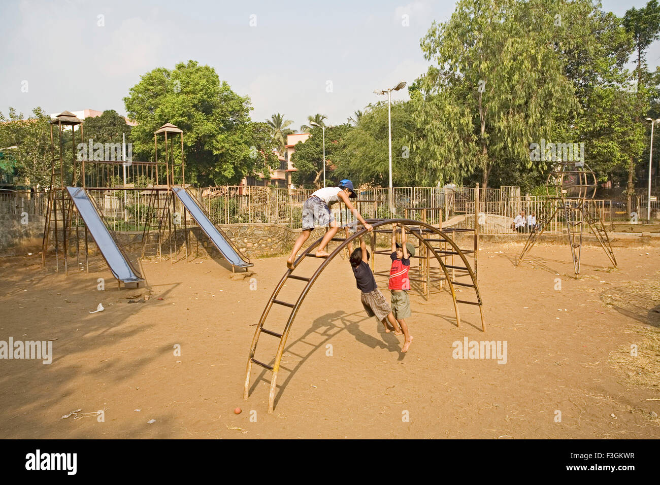 Children playing in a garden maintained by MCGM ; Bombay now Mumbai ; Maharashtra ; India Stock Photo