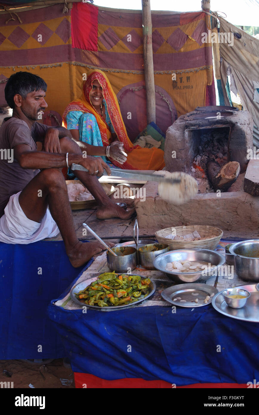 Women preparing roti hi-res stock photography and images - Alamy
