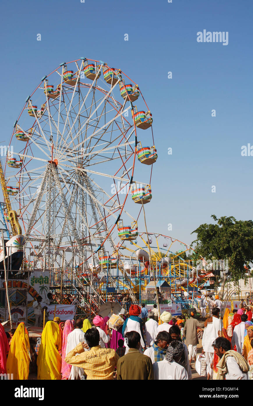 People around giant wheel ; Pushkar ; Rajasthan ; India Stock Photo